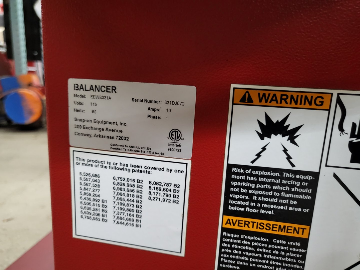 Snap-on Equipment wheel balancer model EEWB331A data plate with serial number and safety warnings