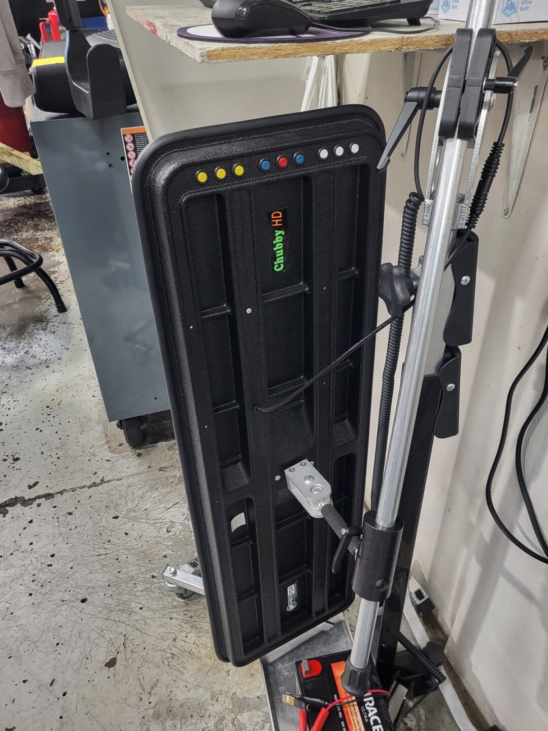 Chubby HD control panel with color-coded buttons mounted in automotive service bay