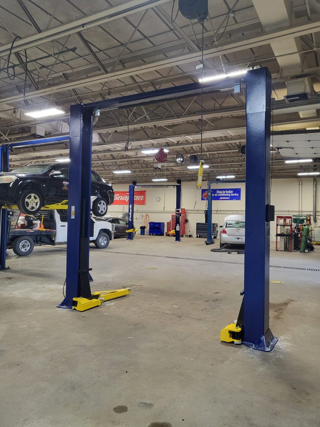 Challenger two-post lift installed by Auto Lift Services in an Iowa shop