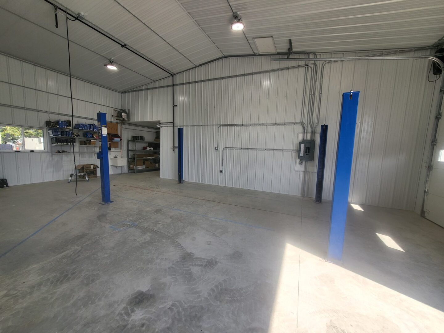 Four-post lift shop layout planned by Auto Lift Services