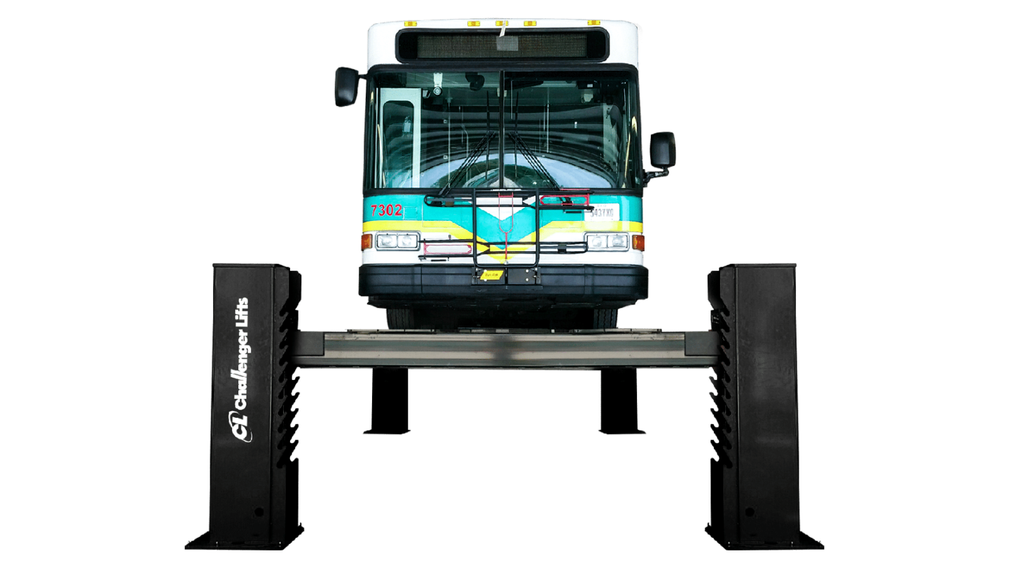 Challenger Lifts heavy-duty 4-post bus lift elevating a transit bus for commercial fleet maintenance