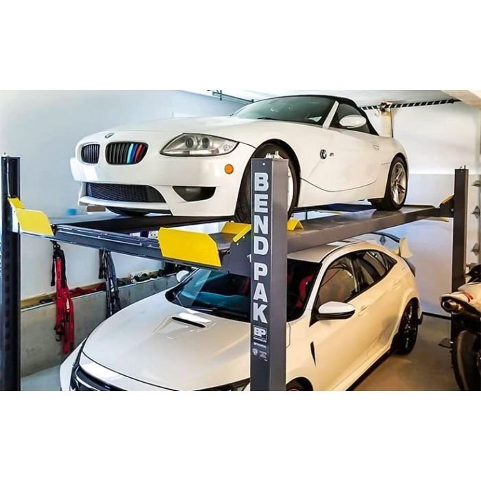 BendPak HD-9 four-post home garage car lift with a car parked on it